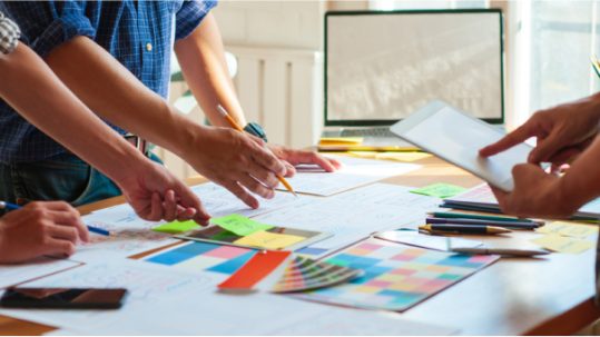 Three people planning a project